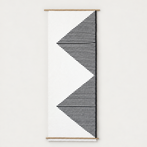 Trian handwoven wall hanging with black and white geometric triangles on bamboo rods, Lale Studio & Shop