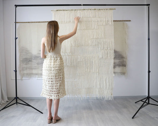 Vapour handwoven wool wall hanging with an open, ethereal weave in natural tones, by Lale Studio & Shop