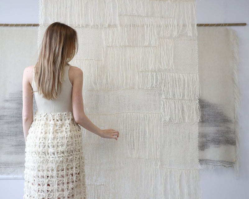 Vapour woven wall hanging styled in a bright minimalist living room
