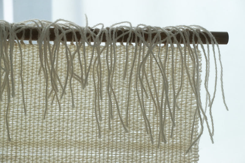 Veil woven wall hanging styled in a calm Japandi living room