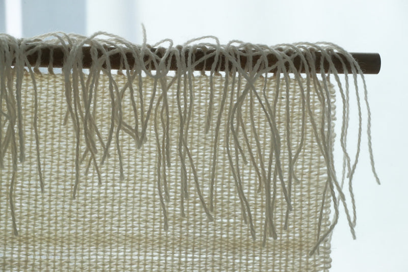 Veil woven wall hanging styled in a calm Japandi living room
