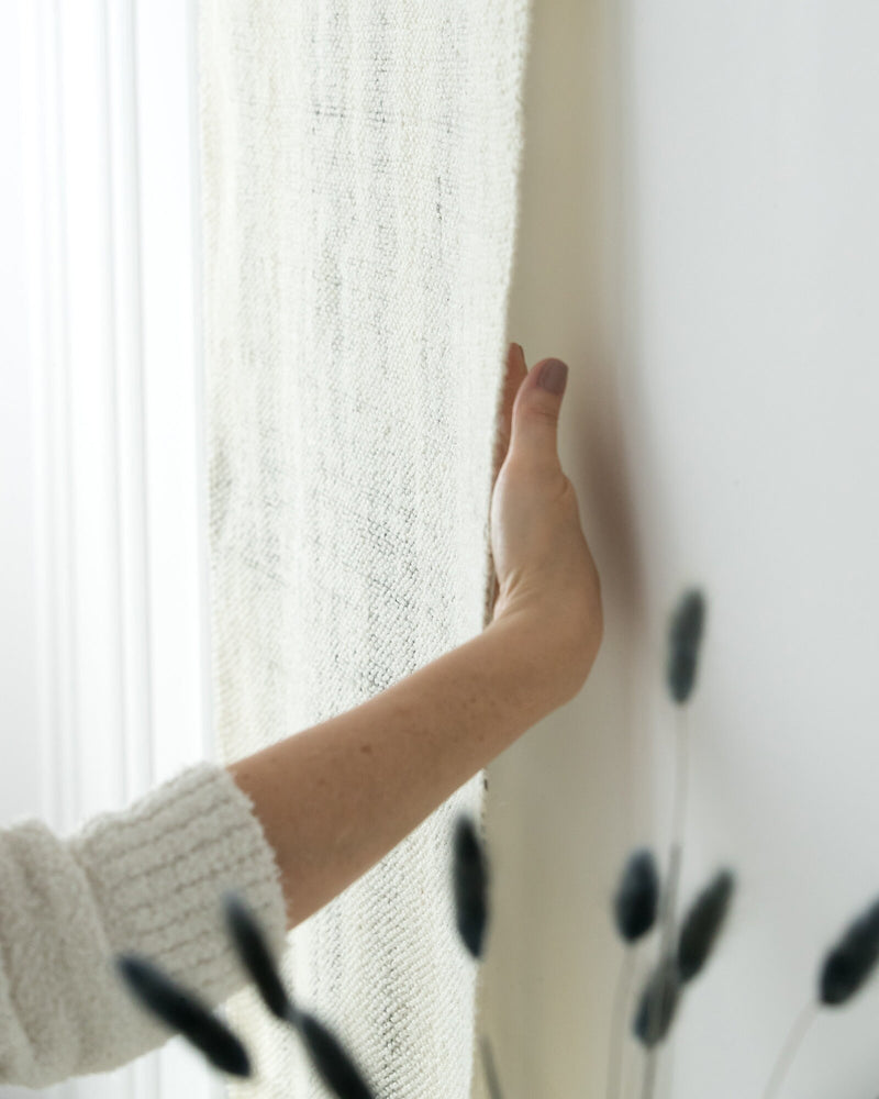 Veil tapestry on a neutral wall, minimalist interior