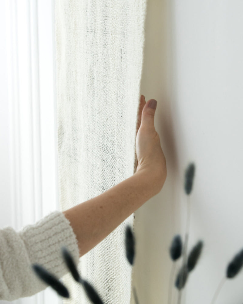 Veil tapestry on a neutral wall, minimalist interior