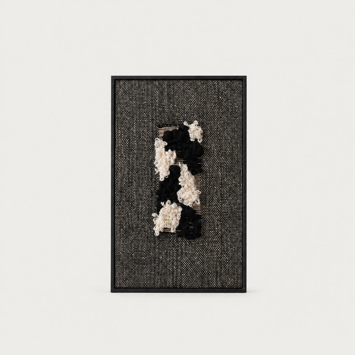 Velmono black and white handwoven wool tapestry in a solid black wooden frame, monochrome textile wall art by Lale Studio & Shop