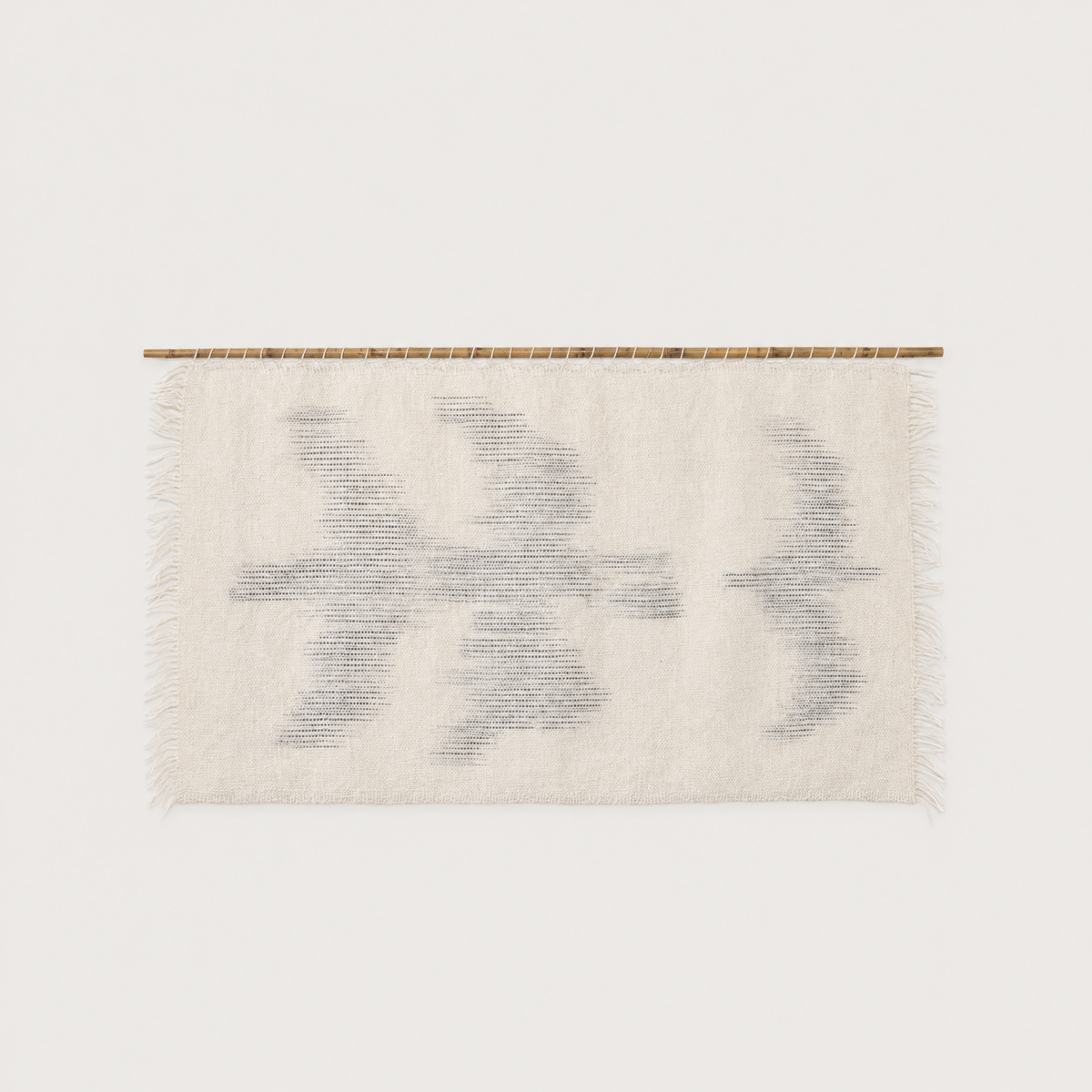 Zeva handwoven wool wall hanging with bird silhouettes on bamboo rod, packshot, Lale Studio & Shop