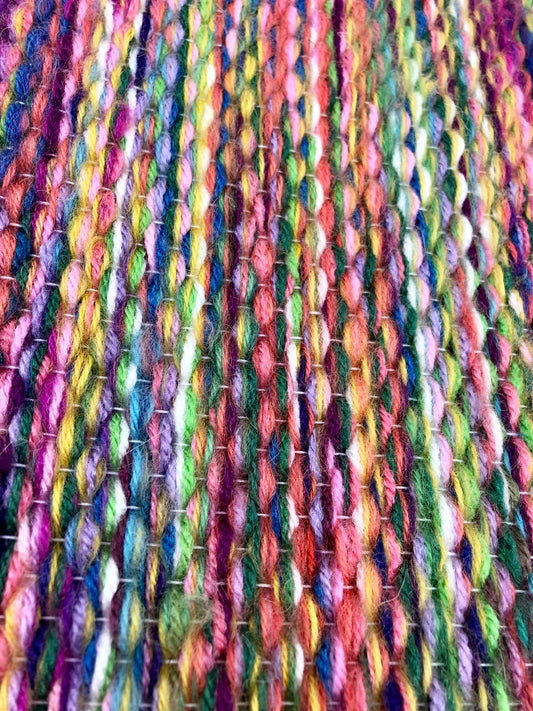 Colora handwoven wool tapestry shown hanging on a wall